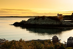 Chairs to Relax on a Warm Summer Sunset by Lighthouse